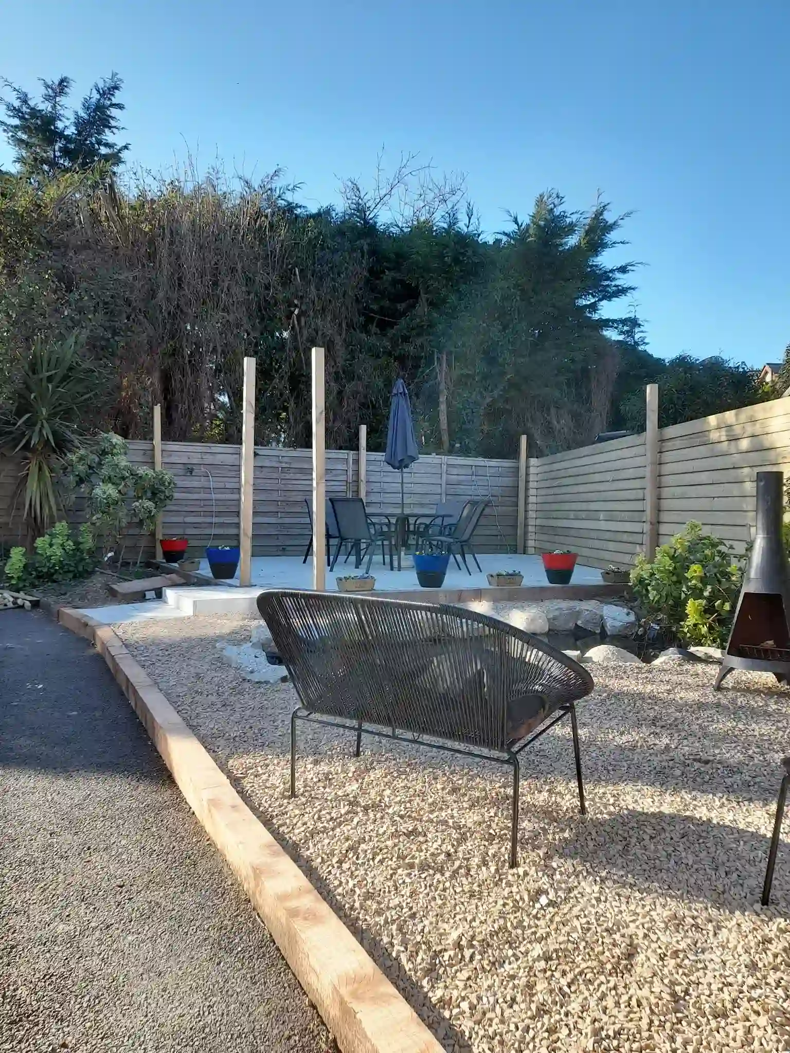 Garden layout before Dublin — pergola posts installed, paving laid, transformation in progress by Reflect General Maintenance