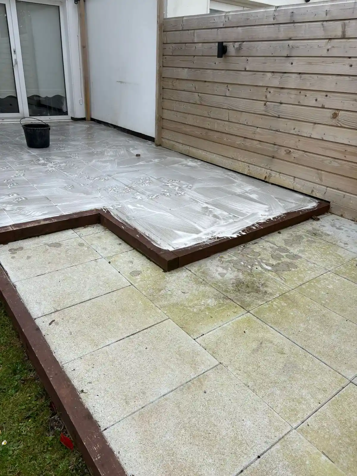 Patio tile restoration showing a cleaner outdoor paving finish during Reflect work