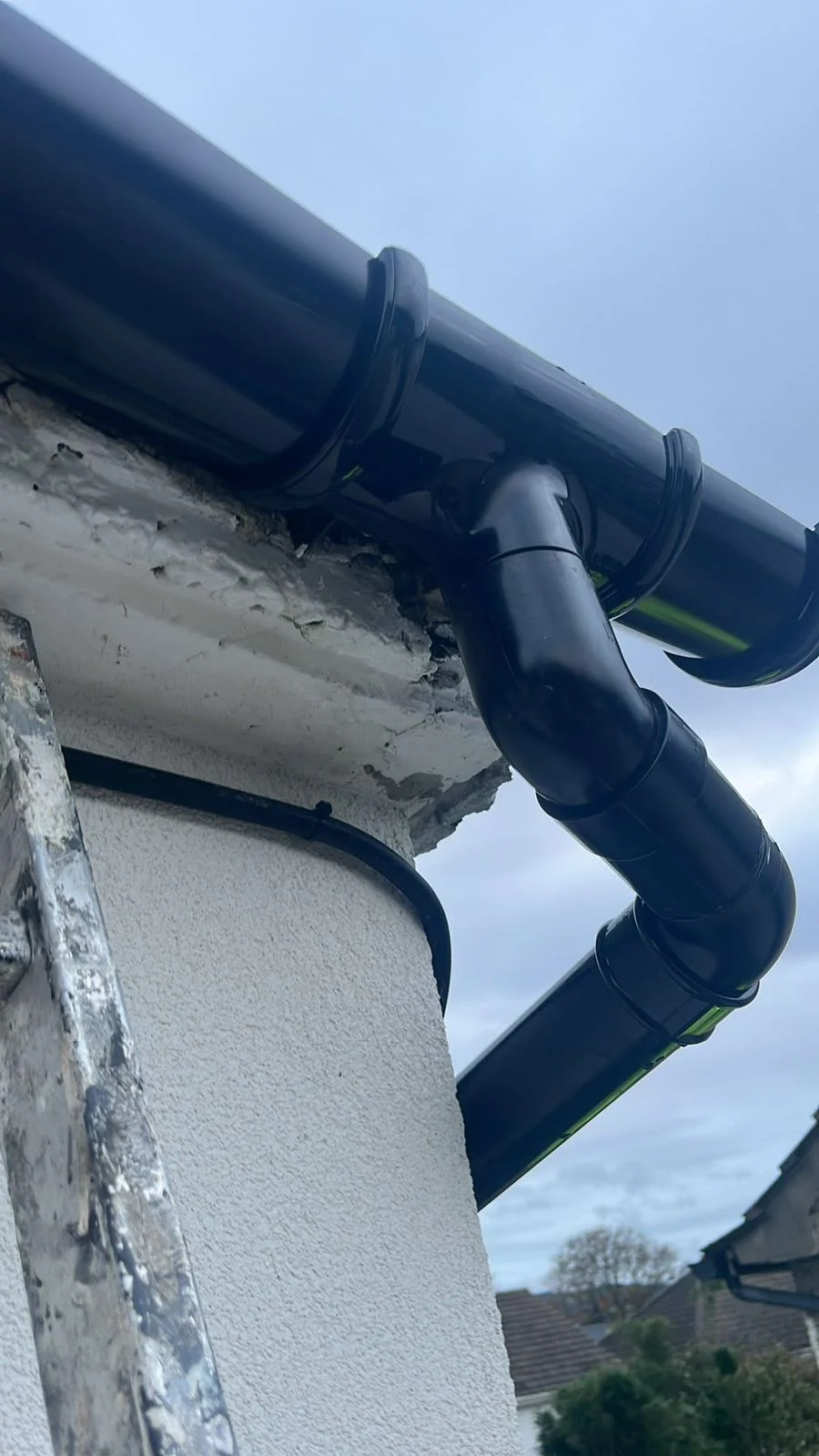 Close-up of downpipe and gutter corner connection