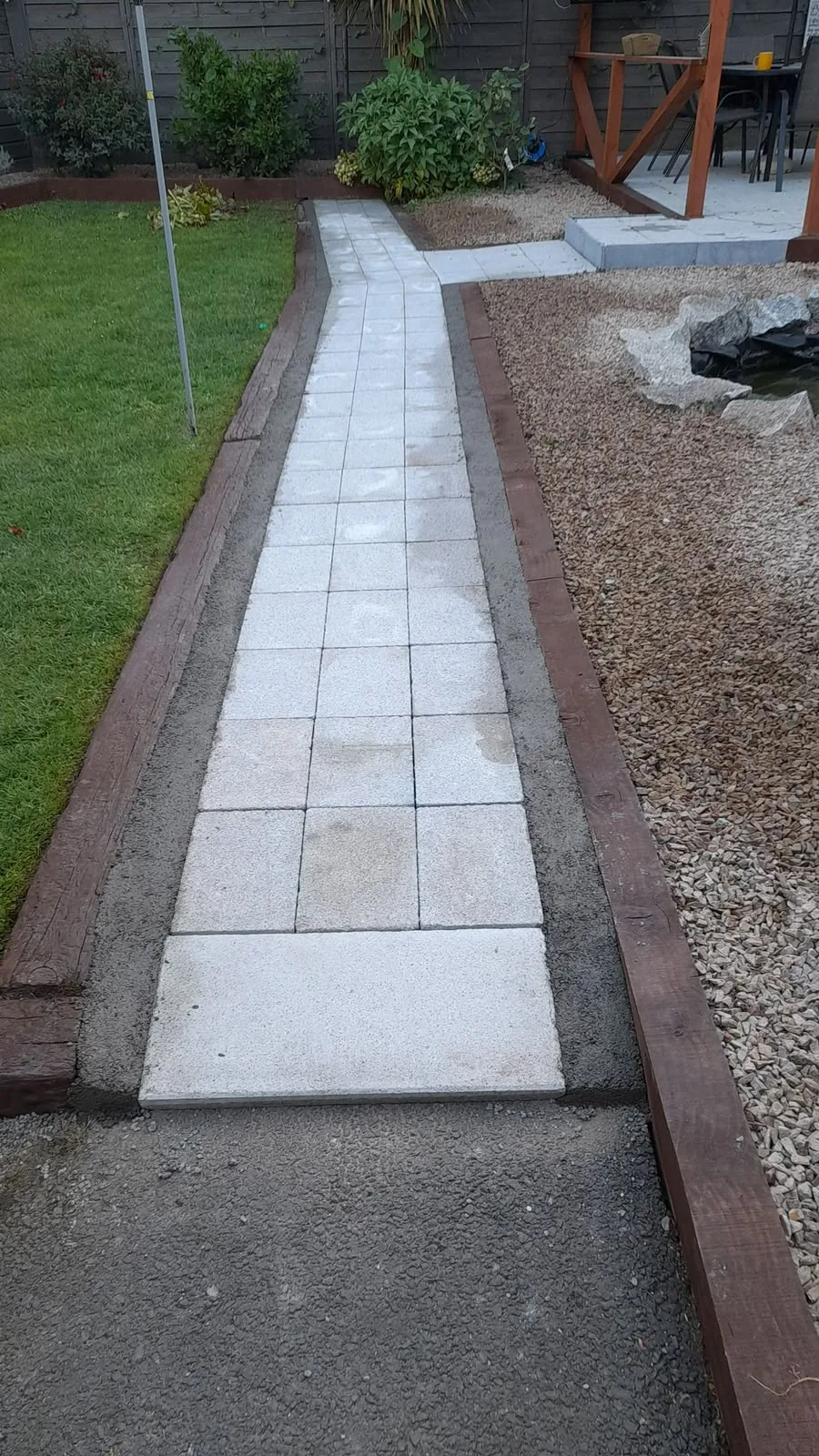 Cleaned garden path slabs in a Dublin garden after power washing