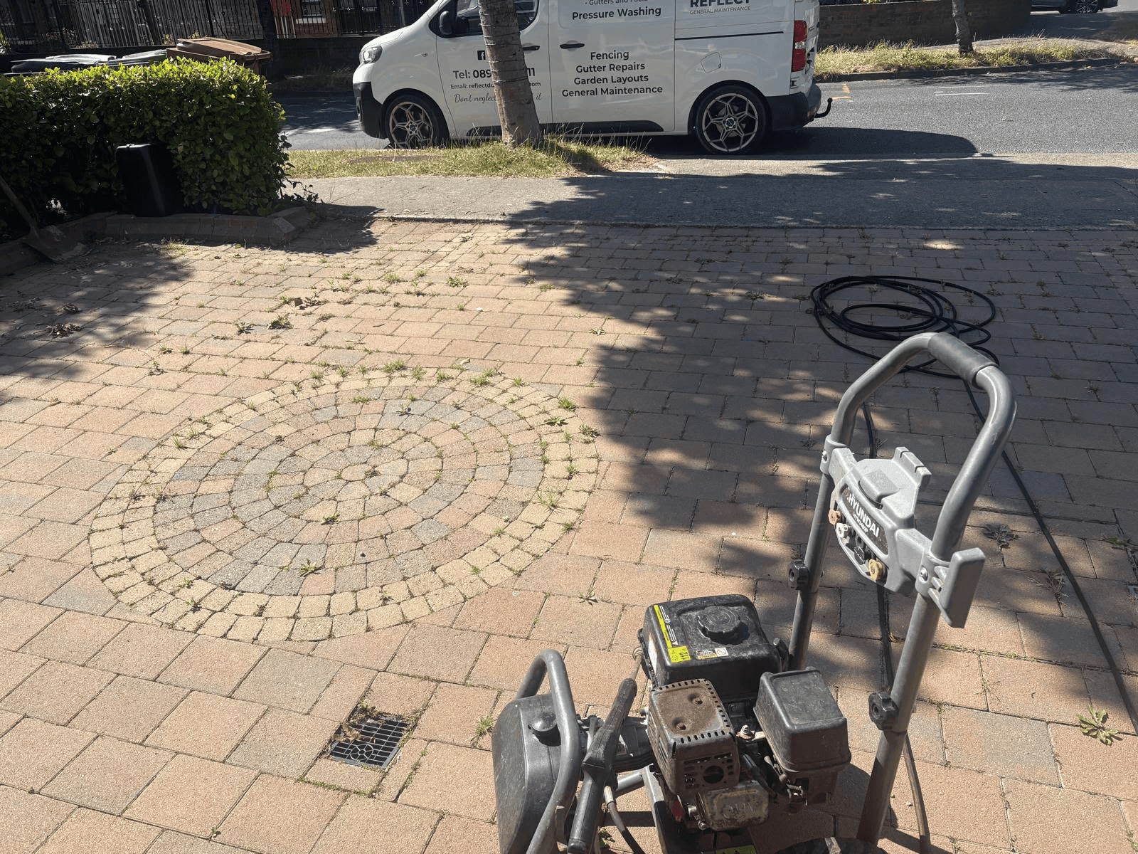 Power washing a block paving driveway in Dublin — Reflect General Maintenance