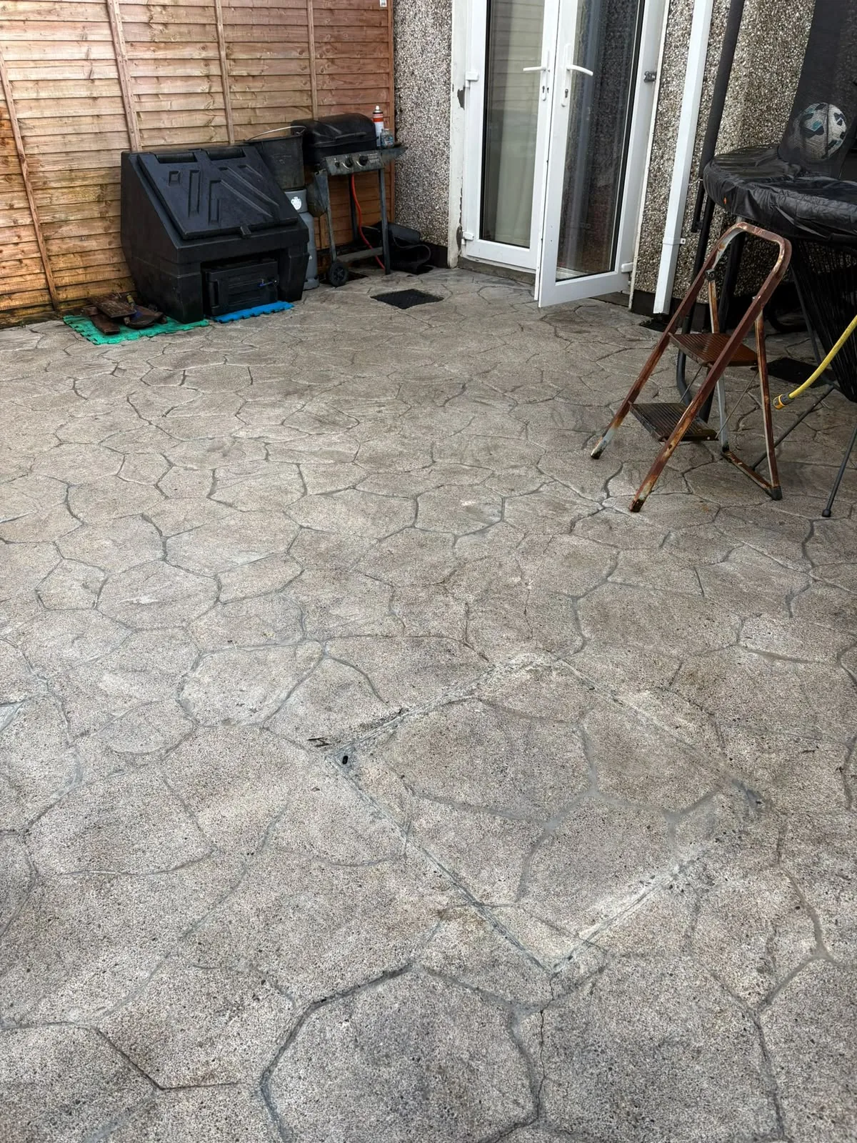 Clean pattern-imprinted concrete patio in Dublin after power washing
