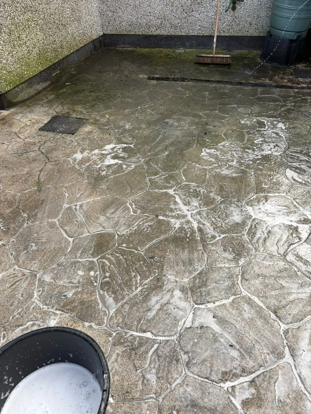 Mossy dirty patio in Dublin before power washing