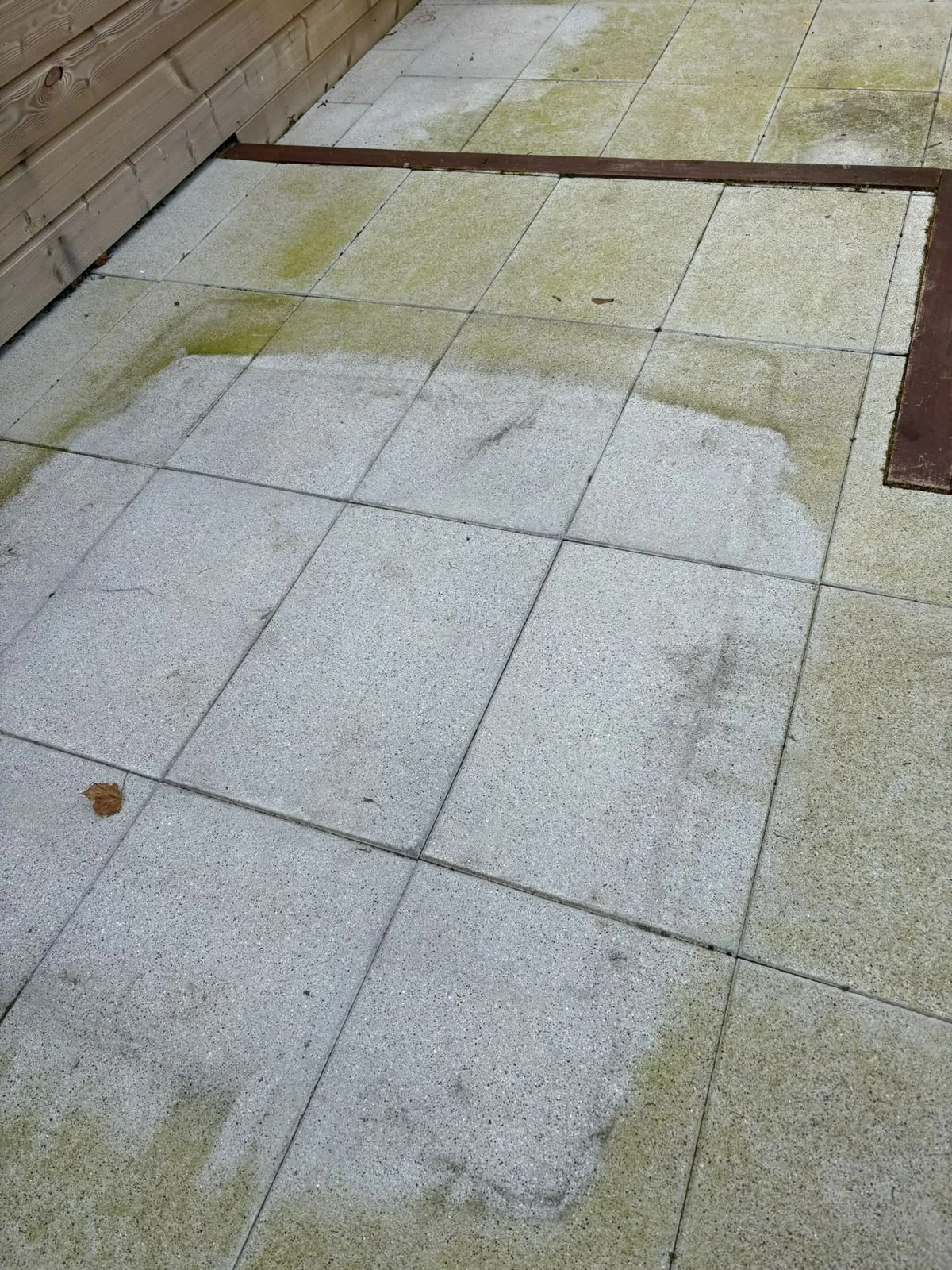 Patio slab restoration in Dublin — algae removed by power washing