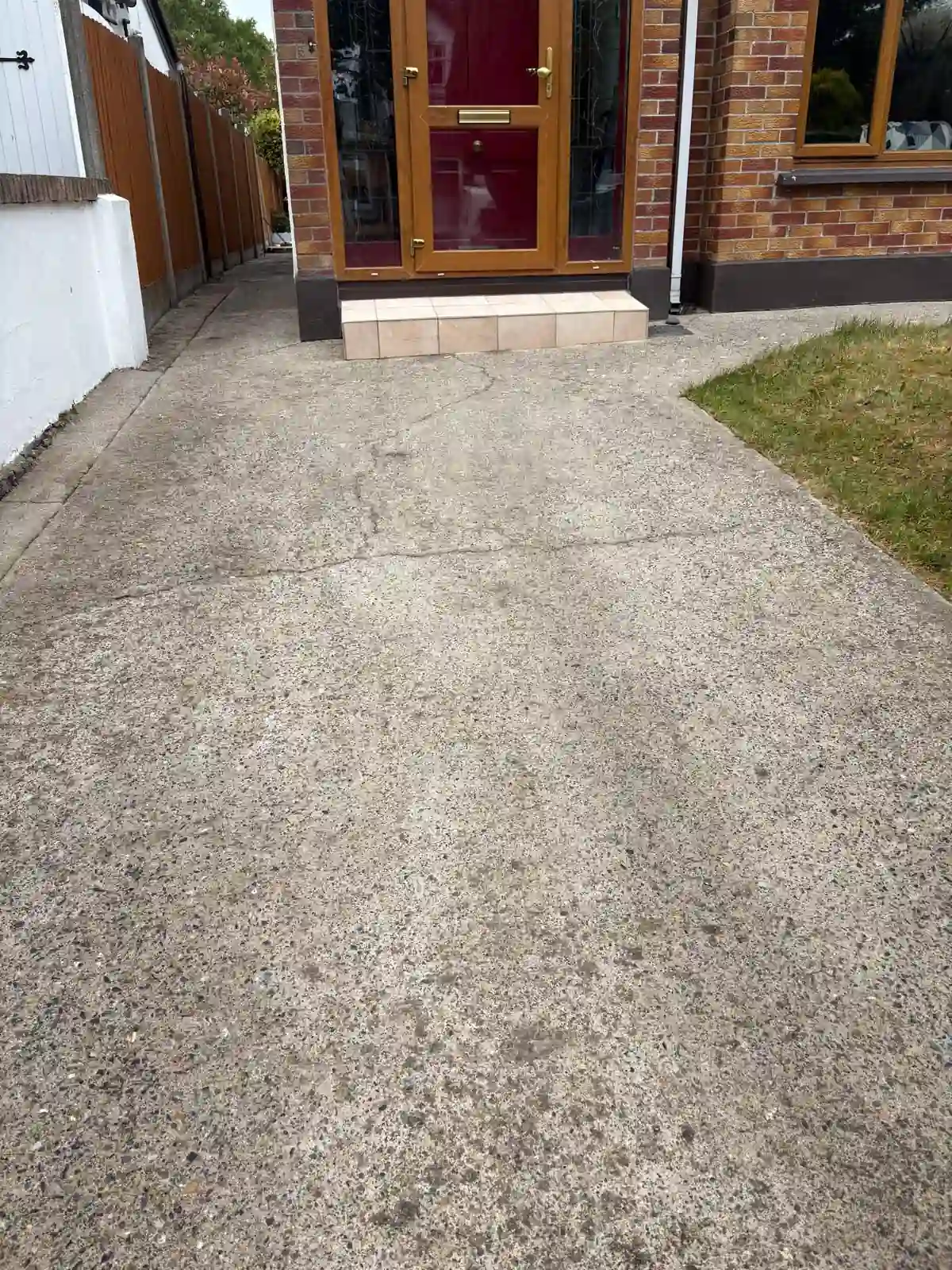 Concrete driveway after power washing by Reflect