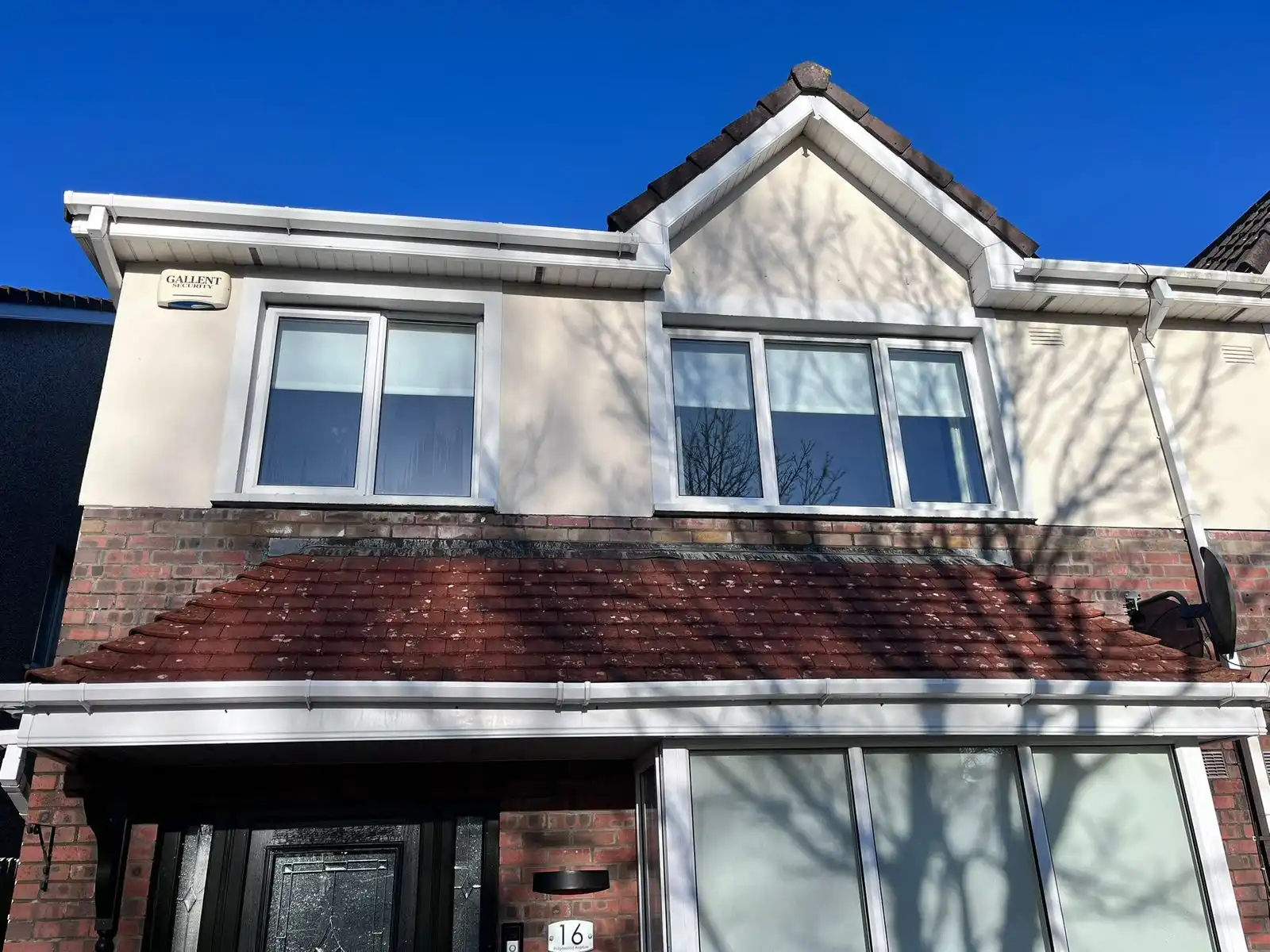 Residential exterior glass being cleaned by Reflect General Maintenance